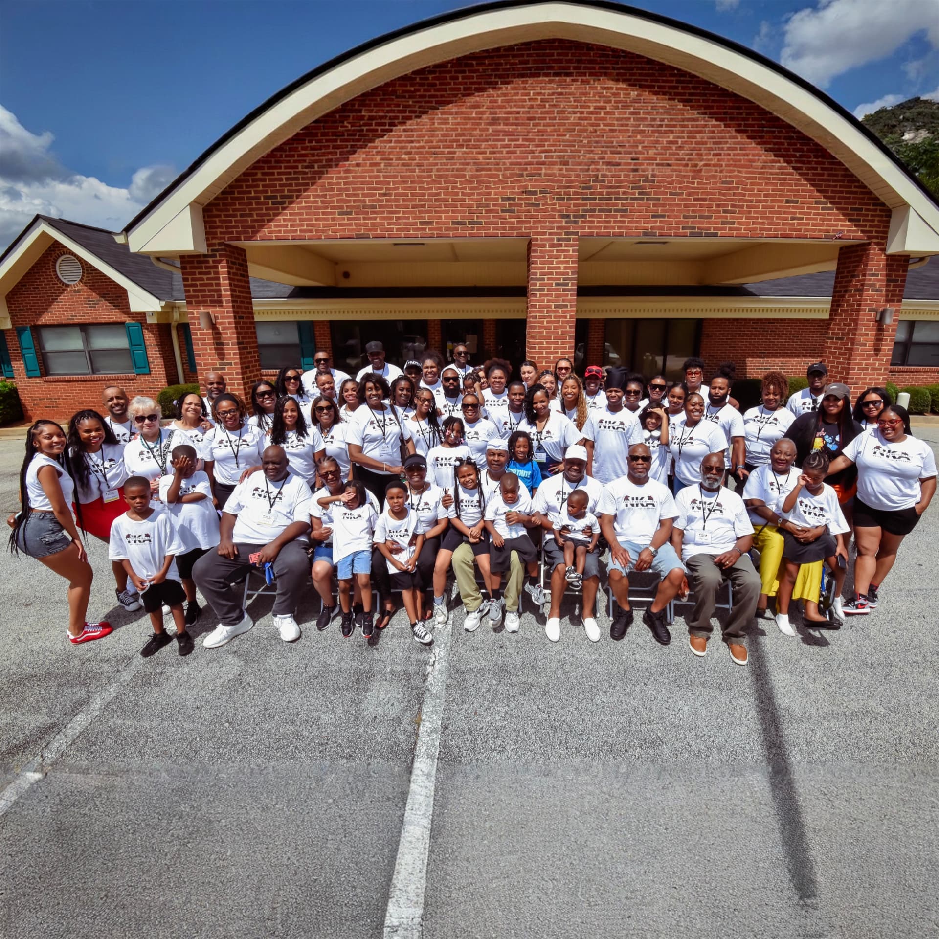 NKA family group photo in matching reunion tees